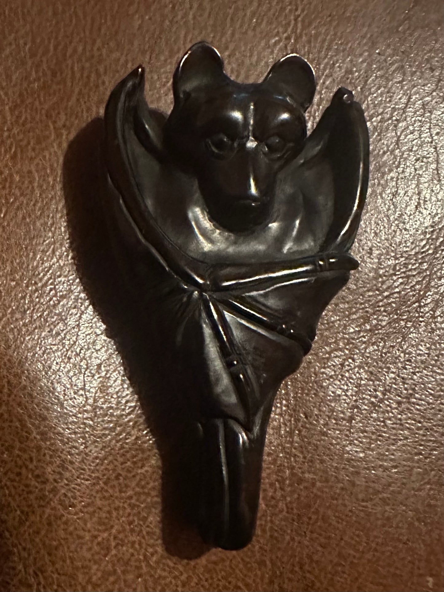 Hand carved Jet Bat